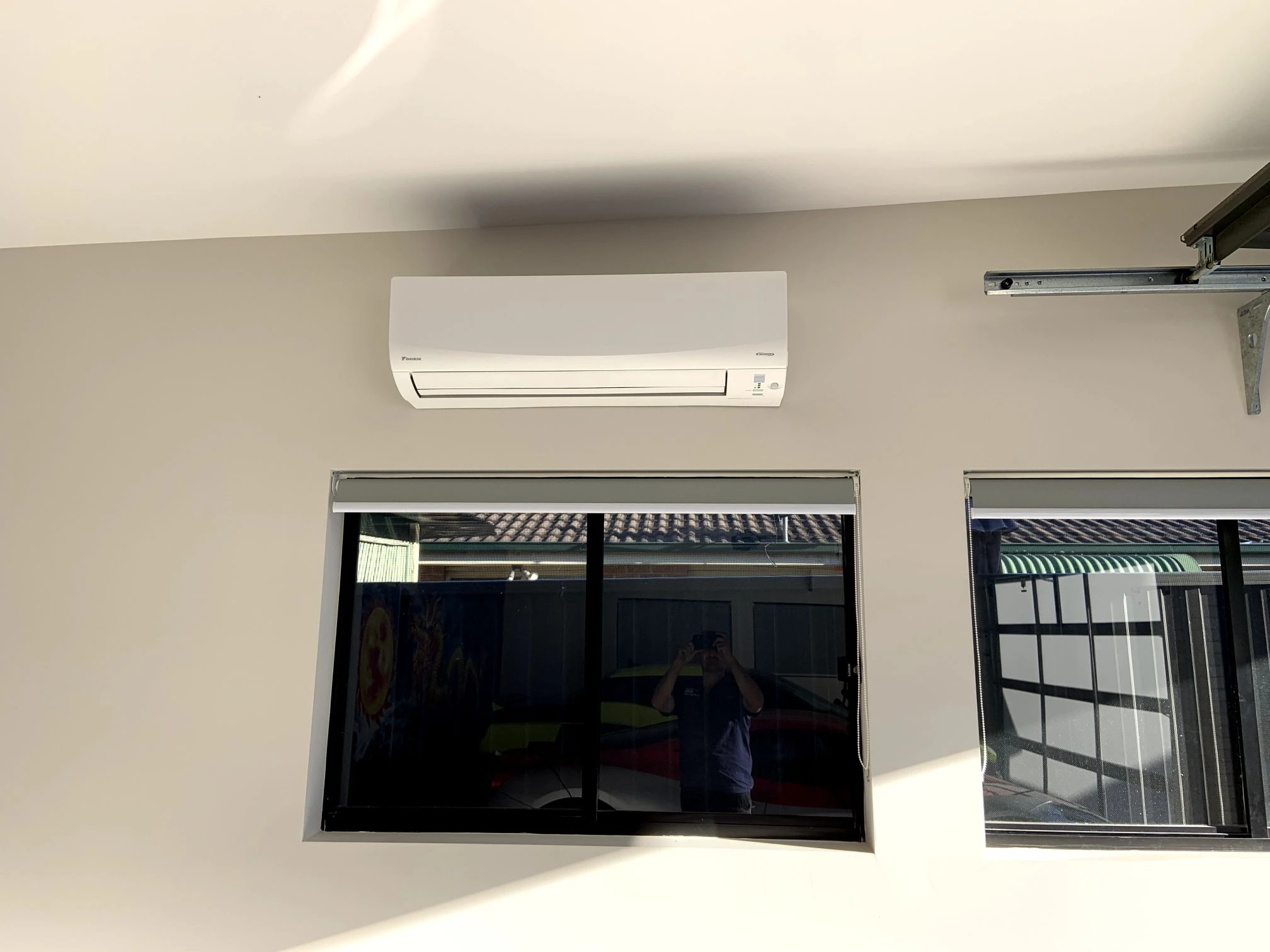 Indoor split system above a living room window